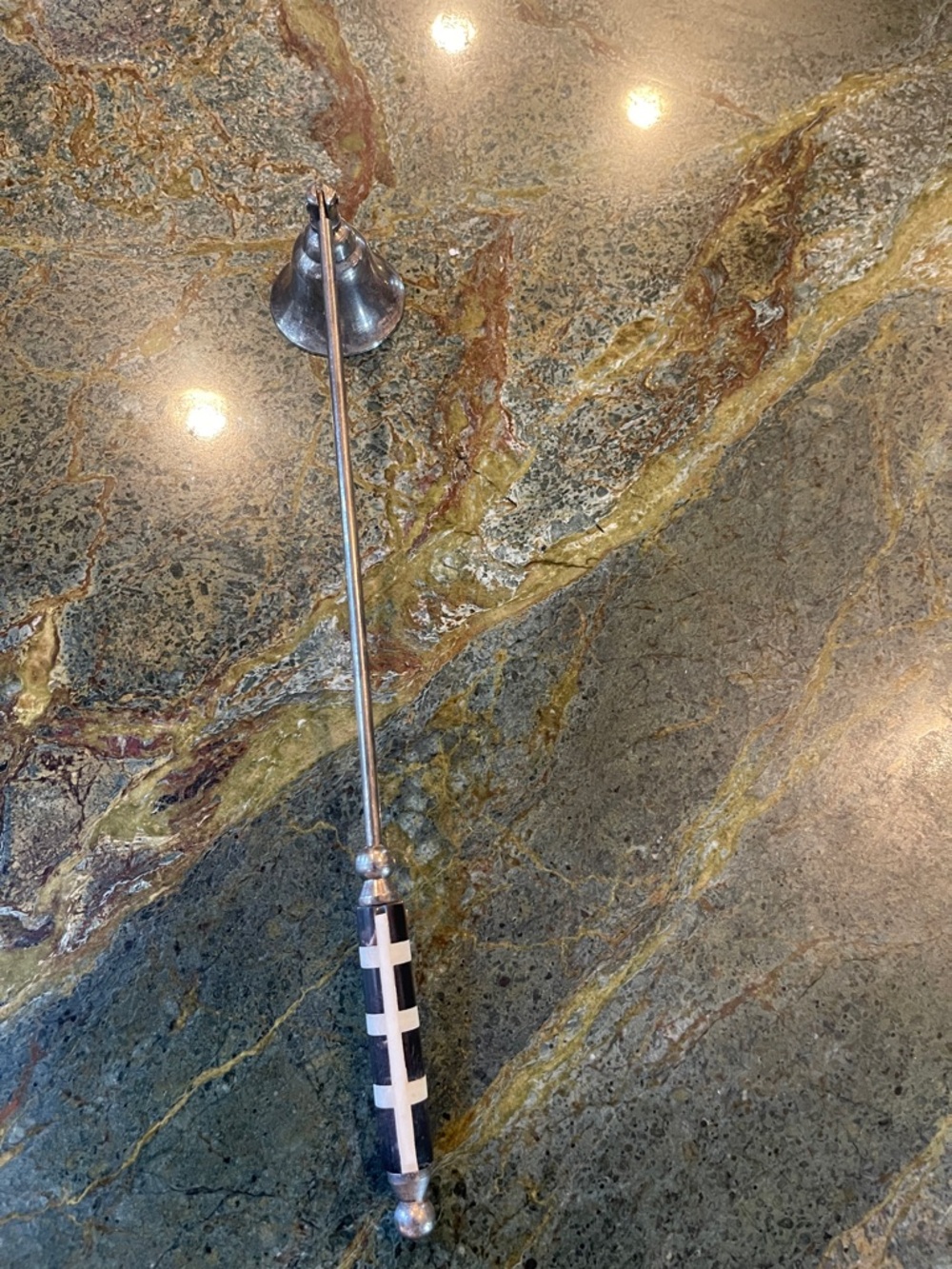 Black and White Patterned candle snuffer with Silver plate Metal Shaft